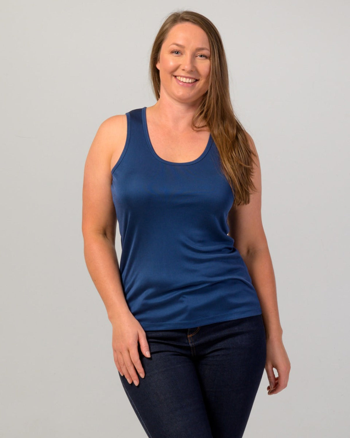 Woman wearing a silk  blue tank top 