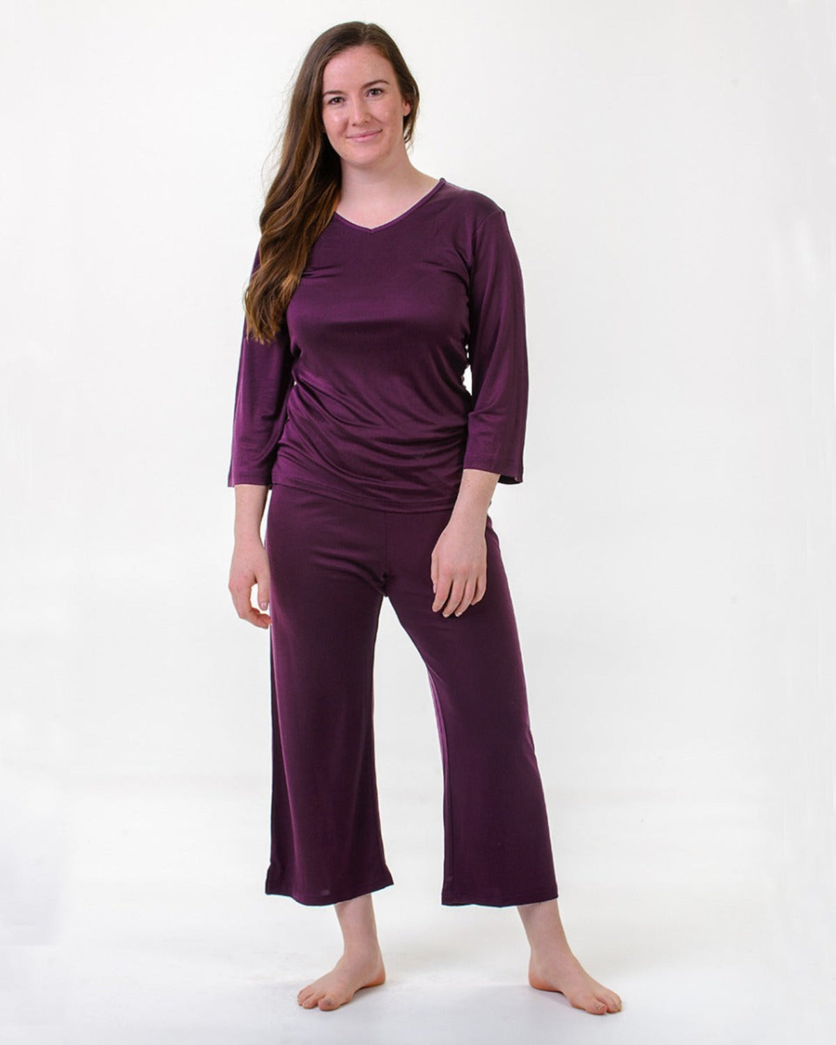 Woman wearing a silk PJ set purple 