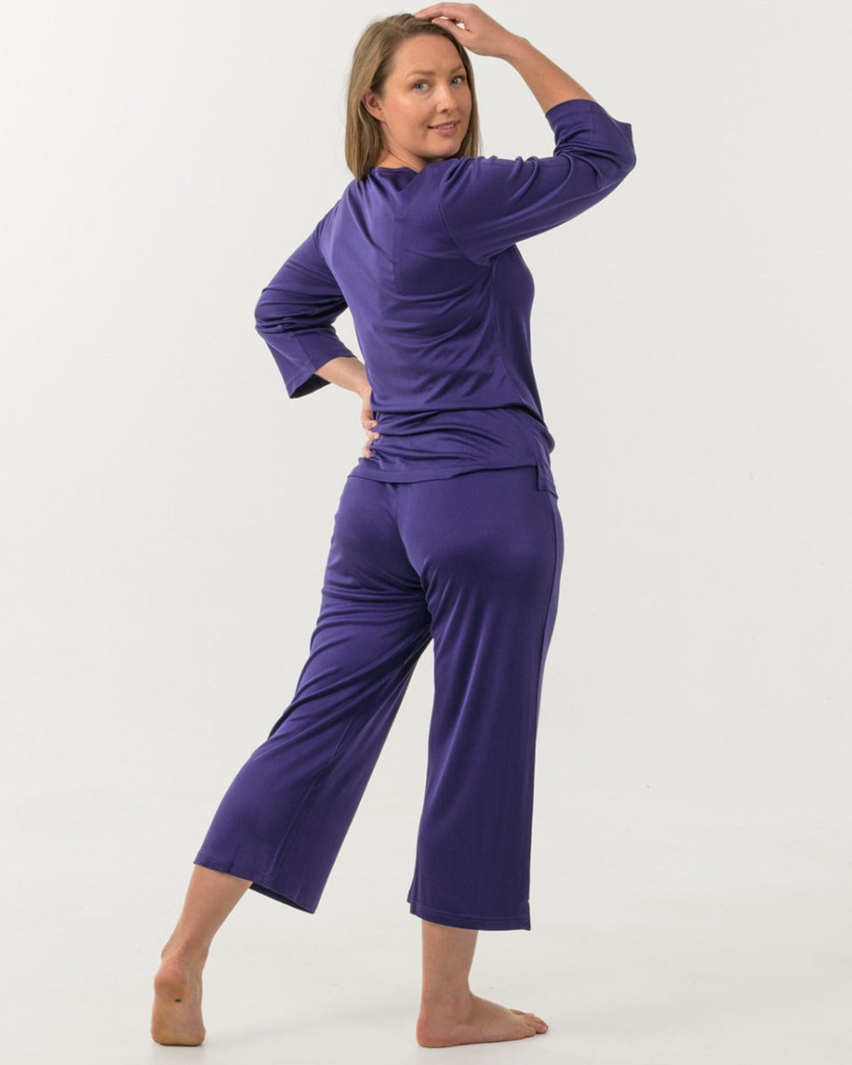 Woman wearing a silk PJ Set purple 