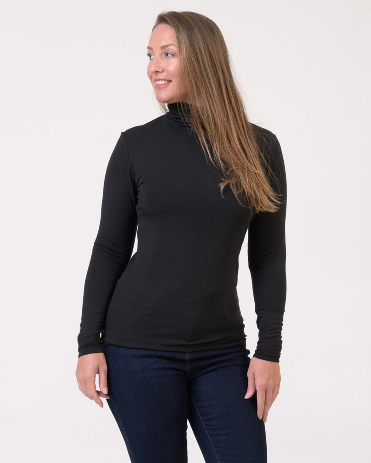 Bamboo Woman wearing a black turtleneck sweater and dark jeans on a white background