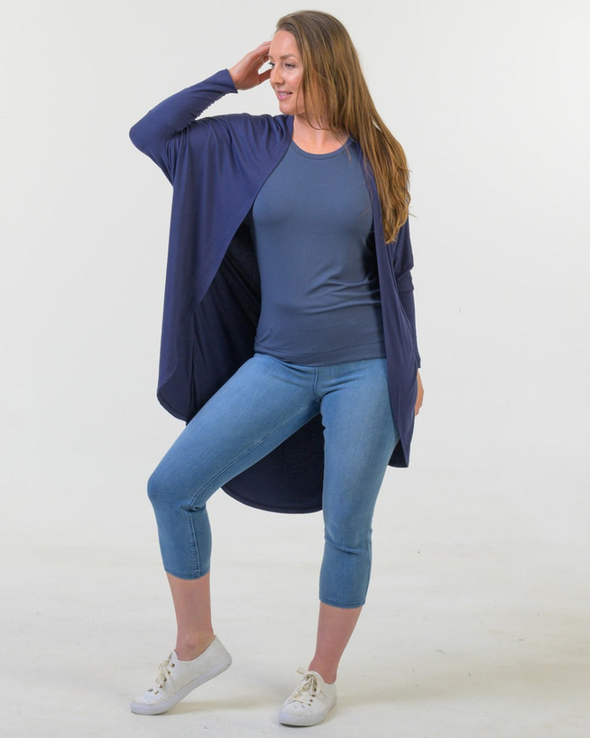 Woman bamboo cocoon wearing a blue outfit with a long cardigan on a white background