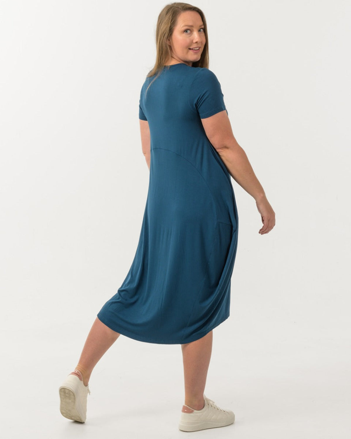 Woman bamboo cocoon wearing a blue dress on a white background