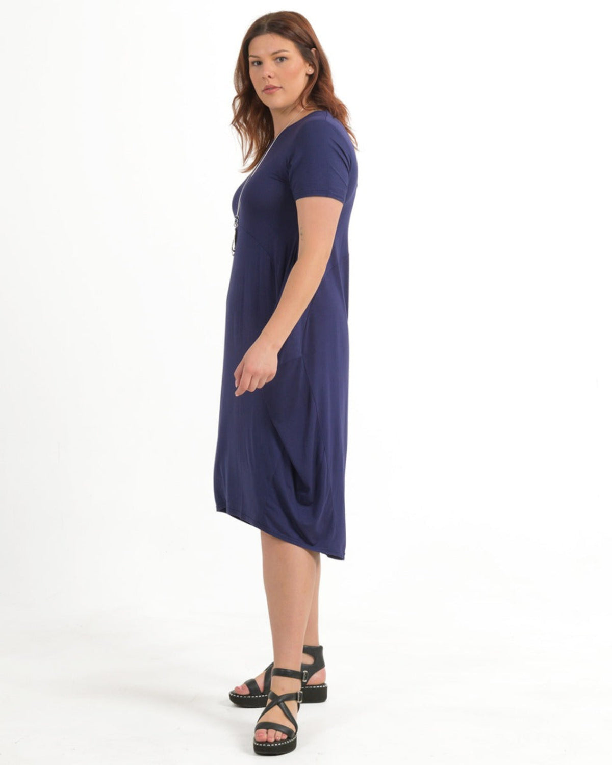 Woman bamboo cocoon wearing a purple dress on a white background