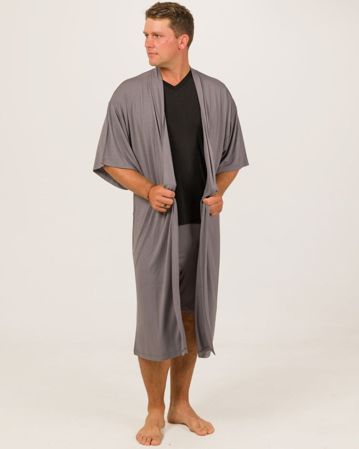 bamboo kimono robe Man wearing a gray robe over a black shirt on a white background