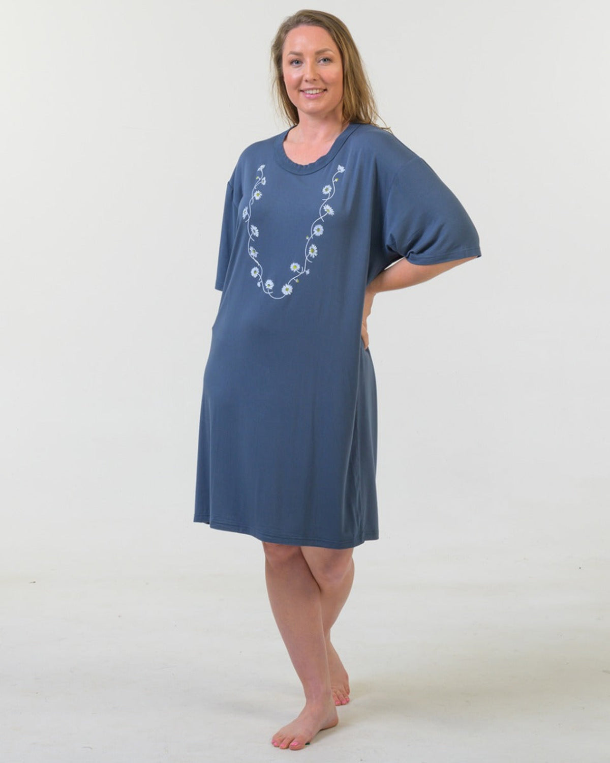 Bamboo Woman wearing a blue dress with a white pattern on a white background