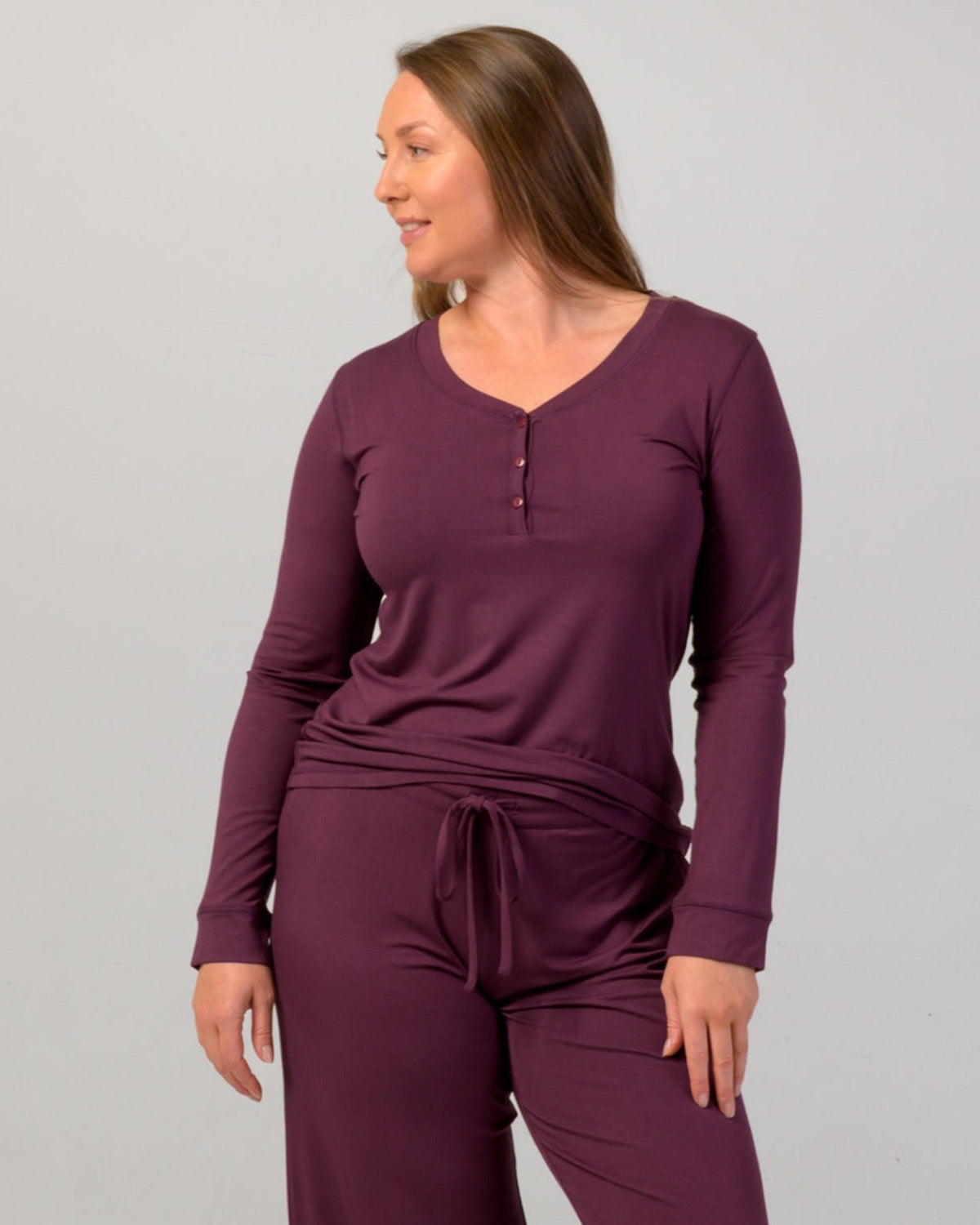 Woman wearing a eggplant  long-sleeve pajama top bamboo