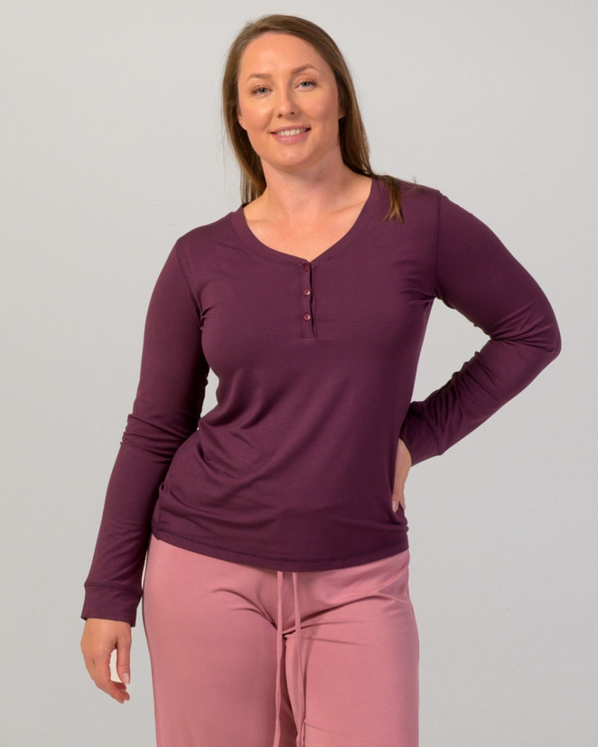 Woman wearing a eggplant  long-sleeve pajama top bamboo
