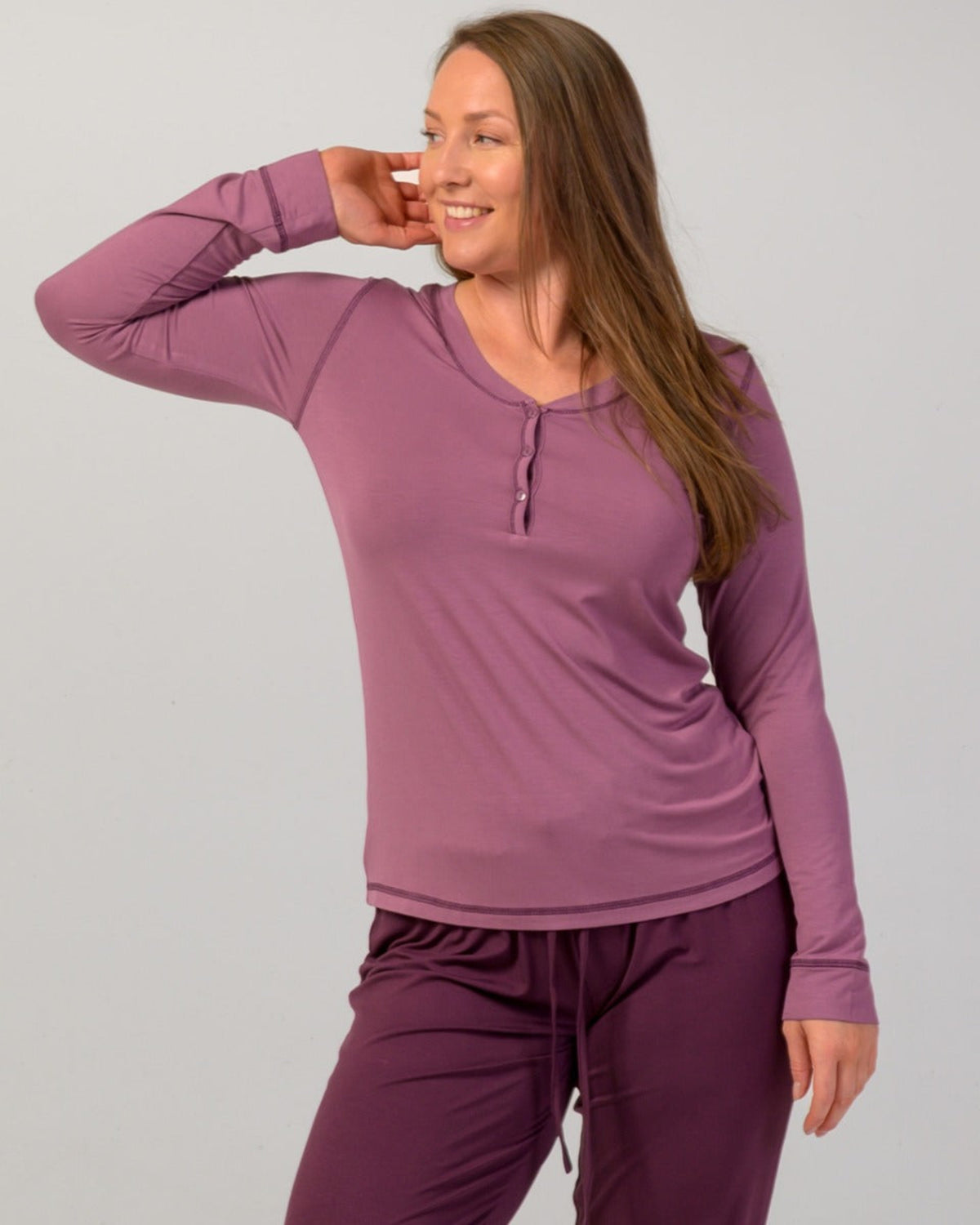 Woman wearing a eggplant  long-sleeve pajama top bamboo