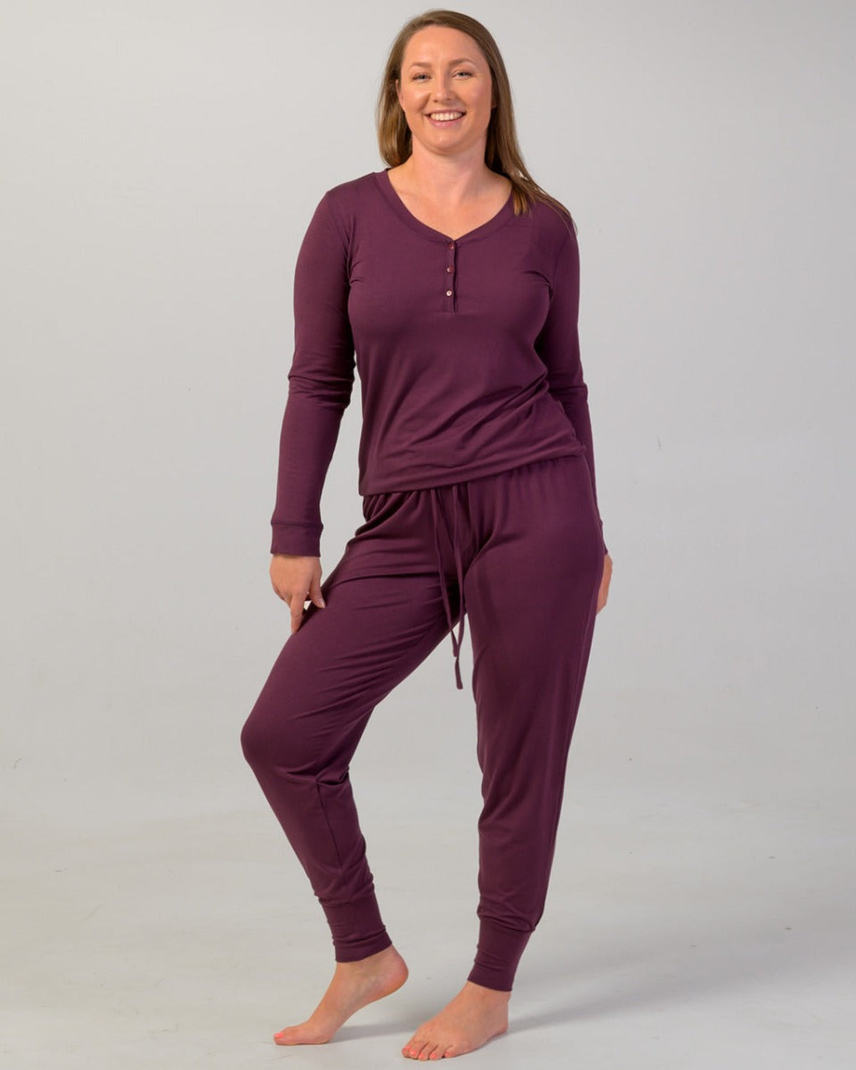 Woman wearing a eggplant  long-sleeve pajama top bamboo