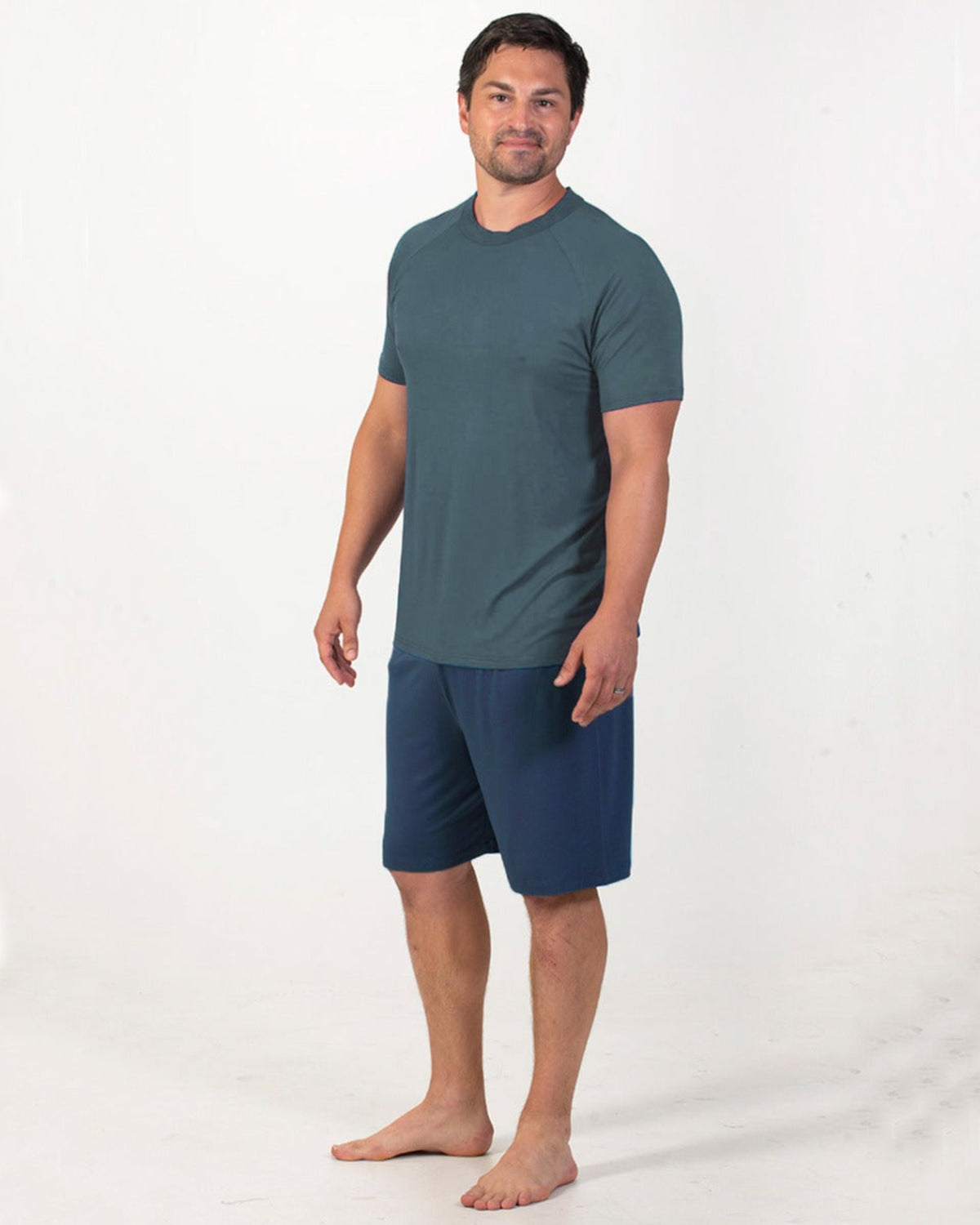 Bamboo Man wearing a green t-shirt and navy shorts on a white background