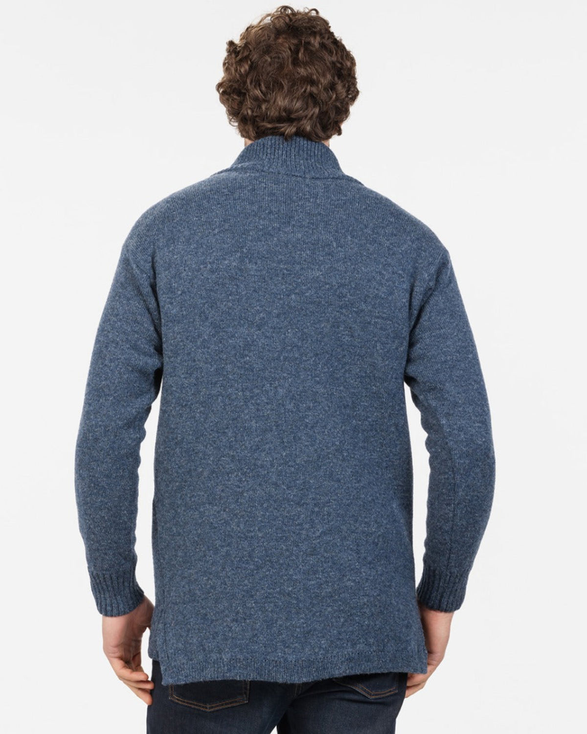 merino possum Person wearing a blue sweater from behind on a white background