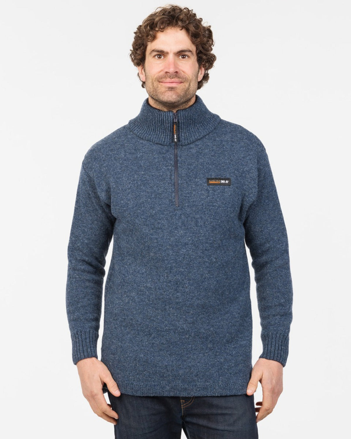 possum merino Man wearing a blue knit sweater with a brand logo on a white background