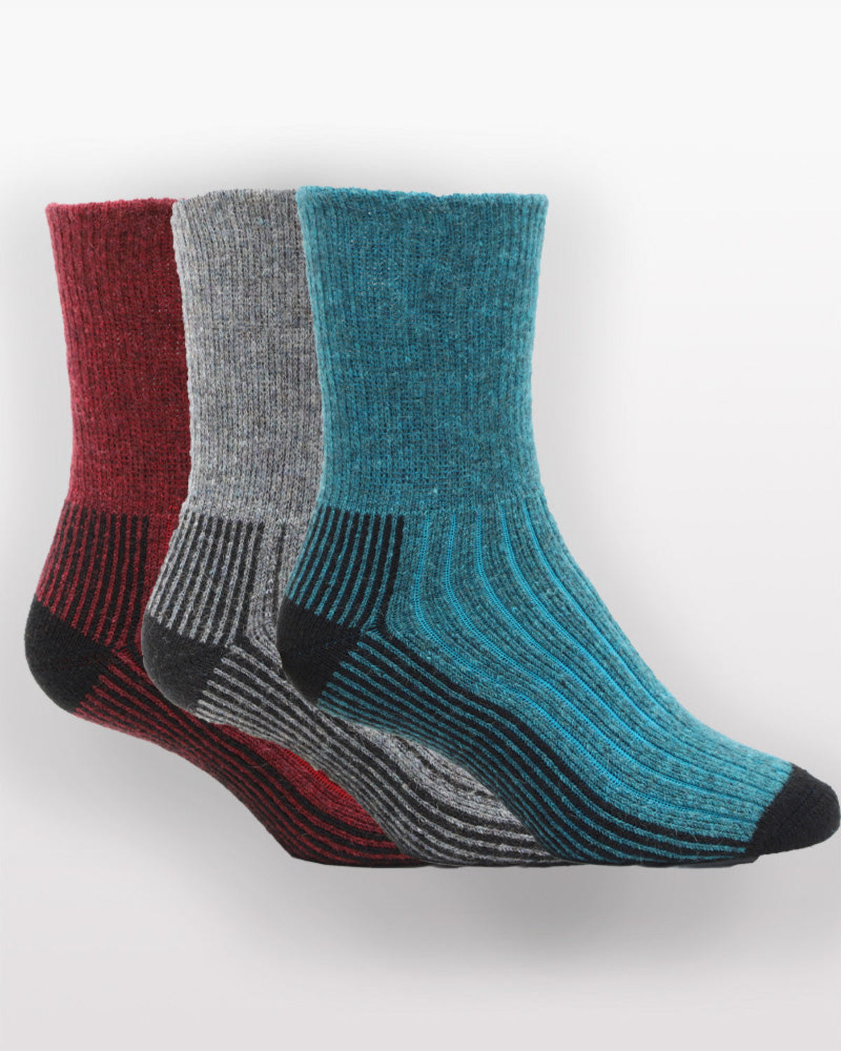 Three pairs of Possum Merino socks in red, gray, and blue on a white background