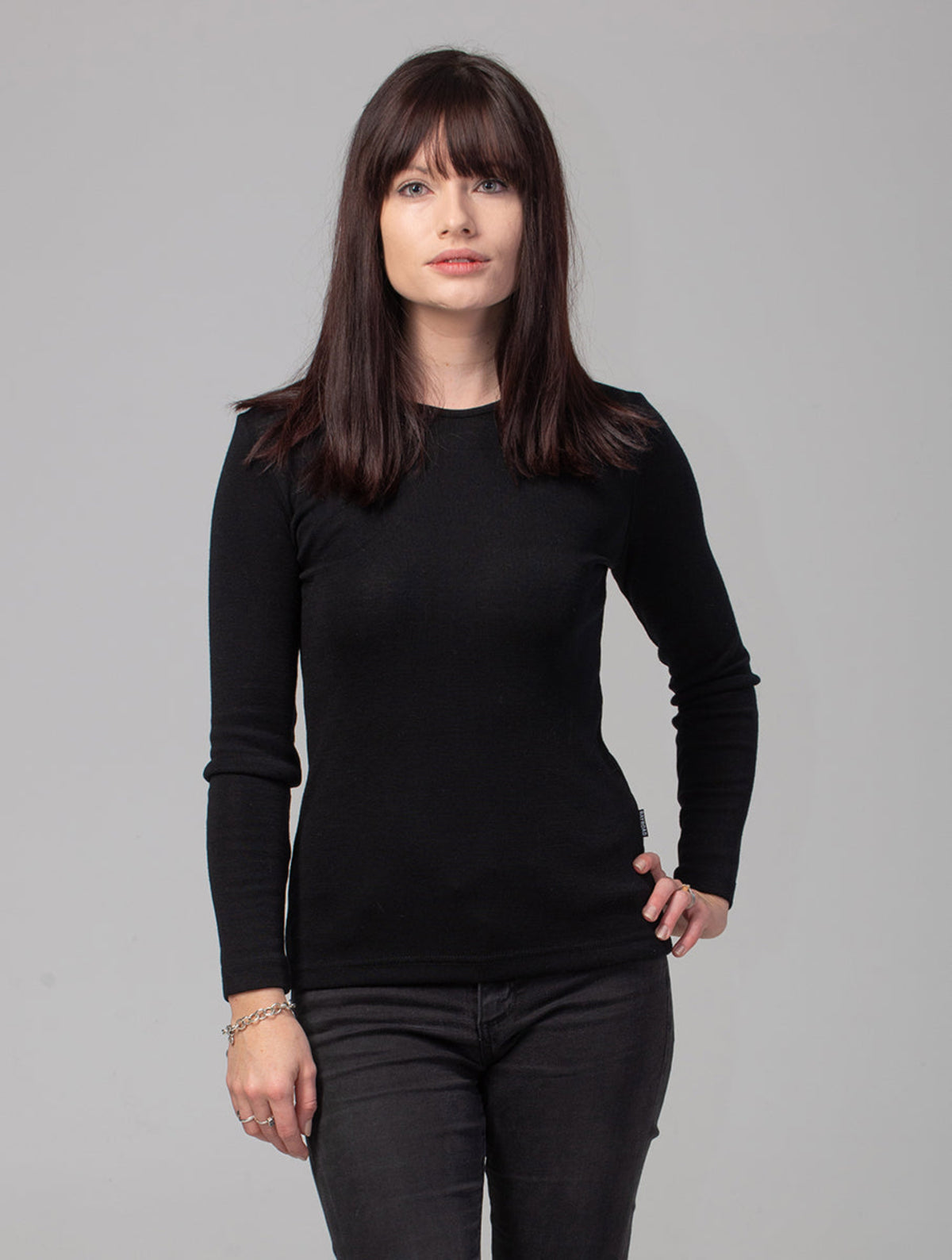 Woman wearing a merino long sleeve crew top