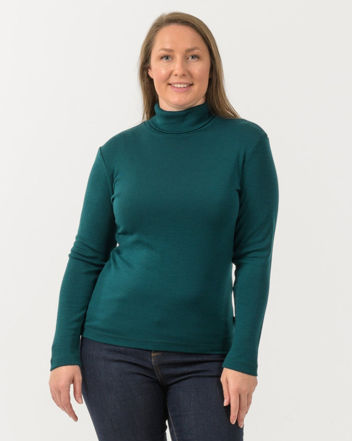 Woman wearing a merino roll neck  turtleneck sweater 