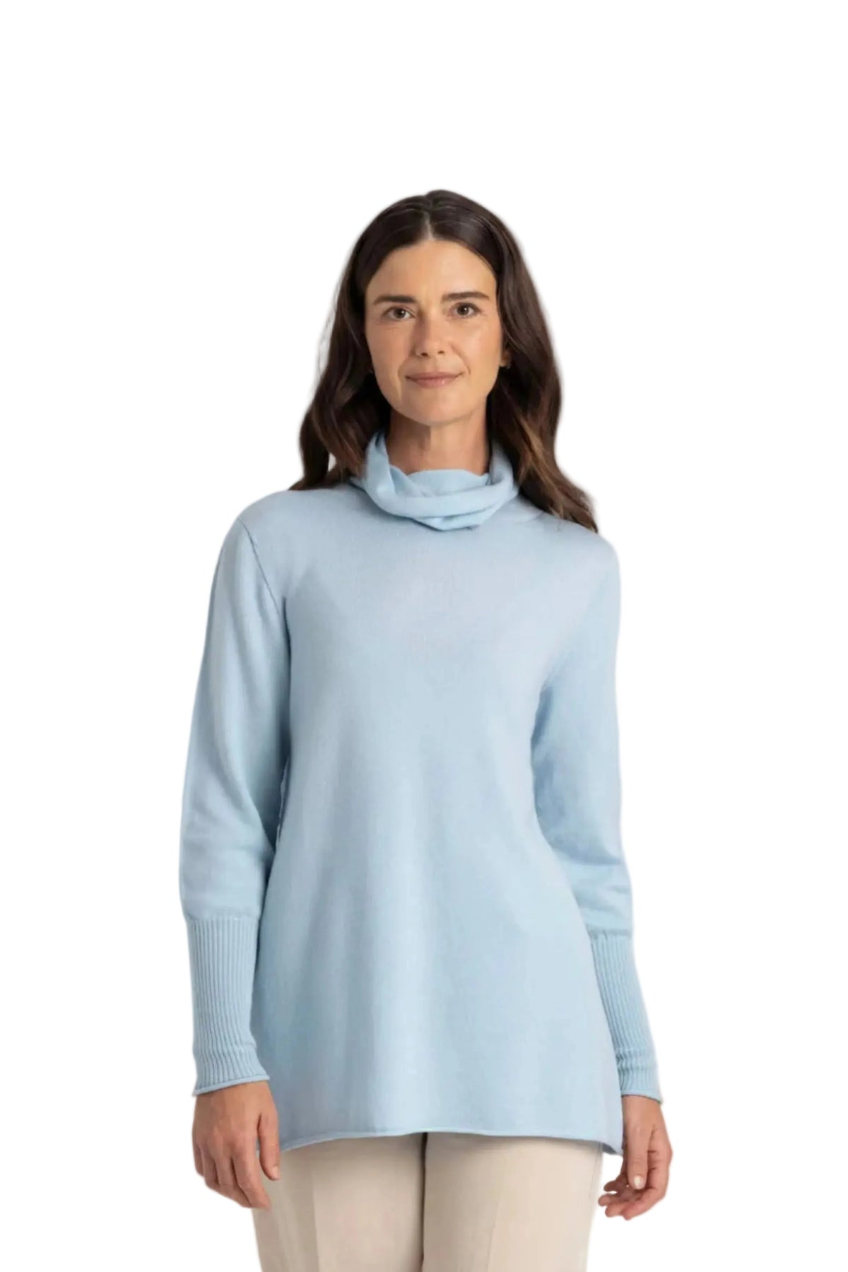 Woman wearing a light merino blue turtleneck sweater on a white background