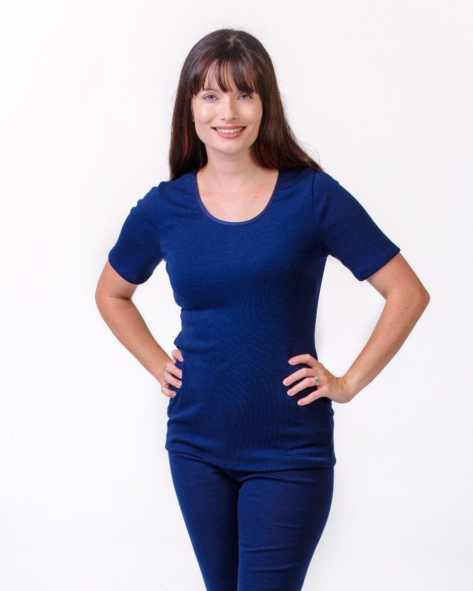 Woman merino wearing a blue outfit on a white background