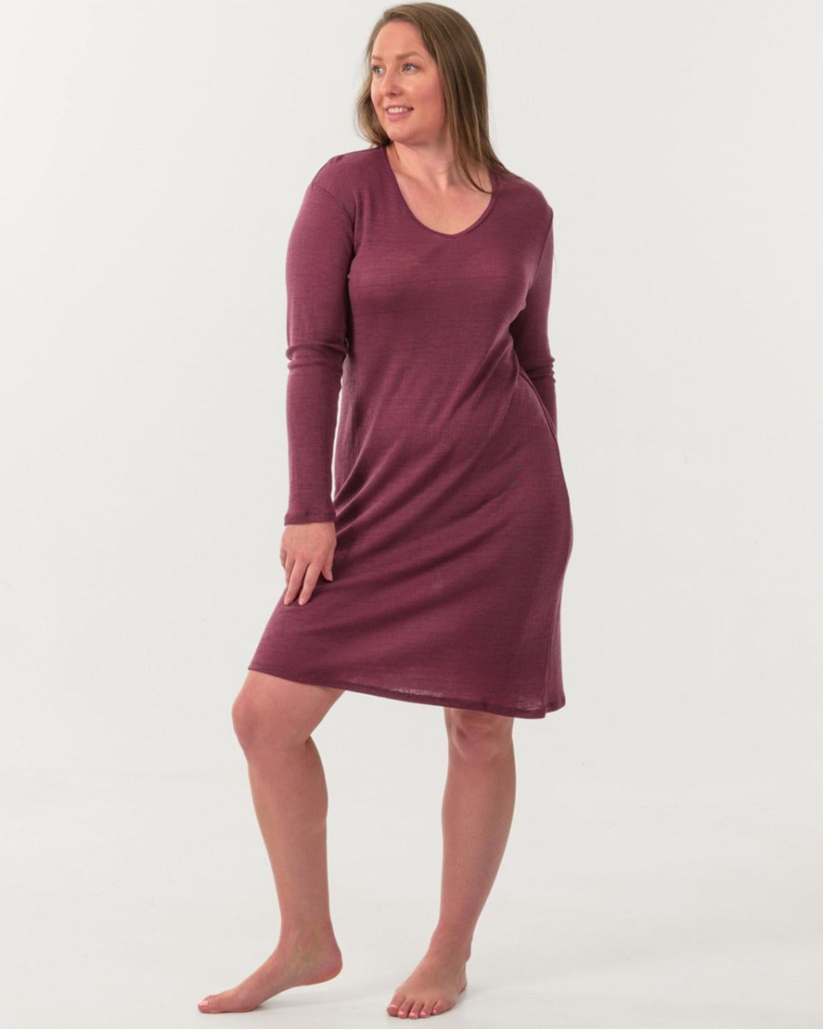 Woman wearing a merino desert rose on a white background