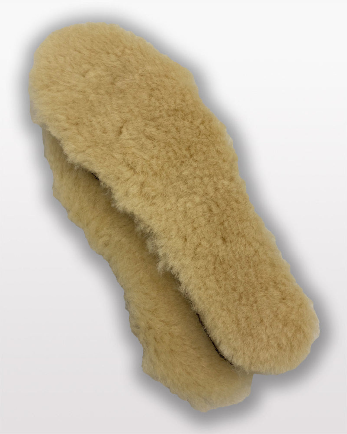 Beige fluffy slippers on a light gray background