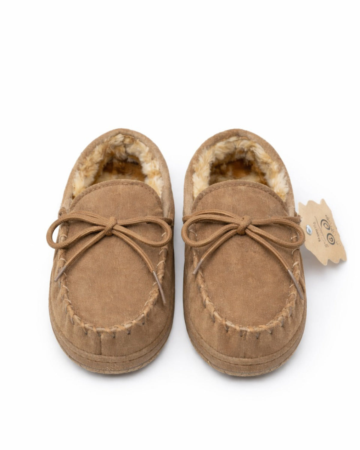 Pair of brown moccasin slippers with fur lining on a white background