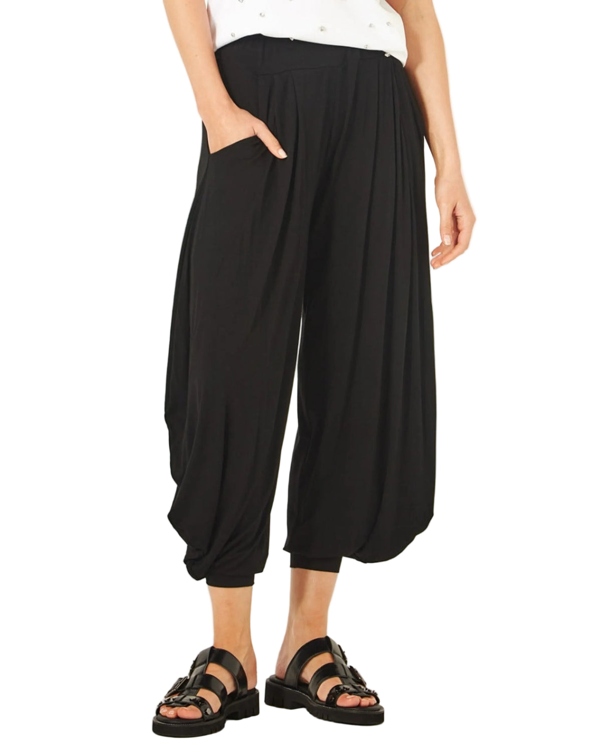 Viscoe Person wearing black wide-leg pants on a white background