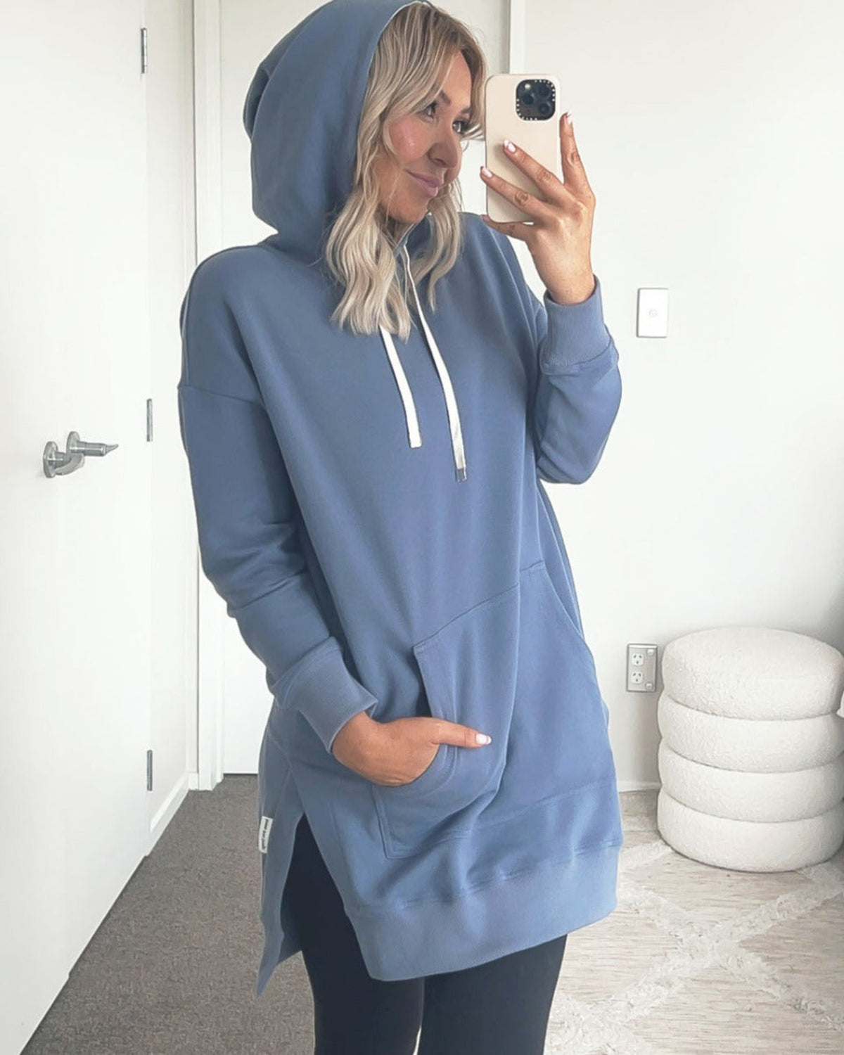 Woman wearing a blue hoodie 