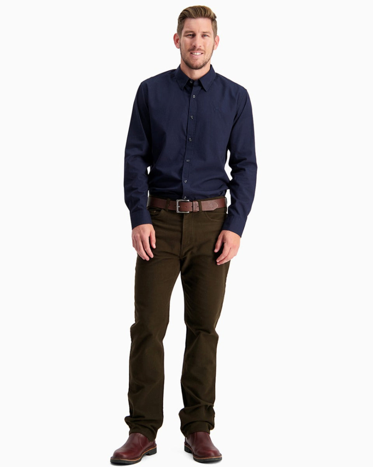 moleskin Man wearing a navy shirt and brown pants on a white background