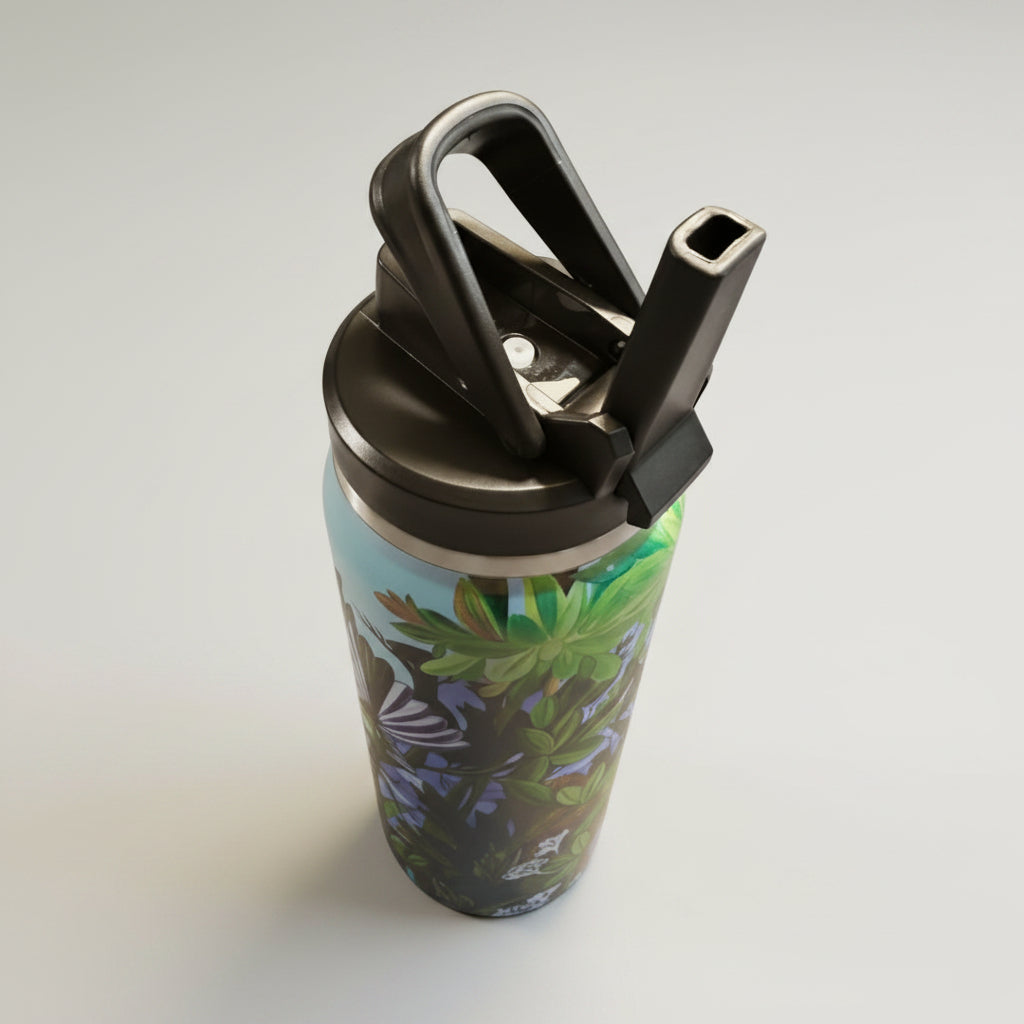 Tumbler with floral design and gold lid on a white background