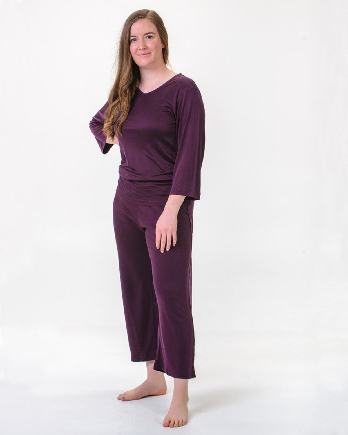 Woman wearing a silk pj set purple 