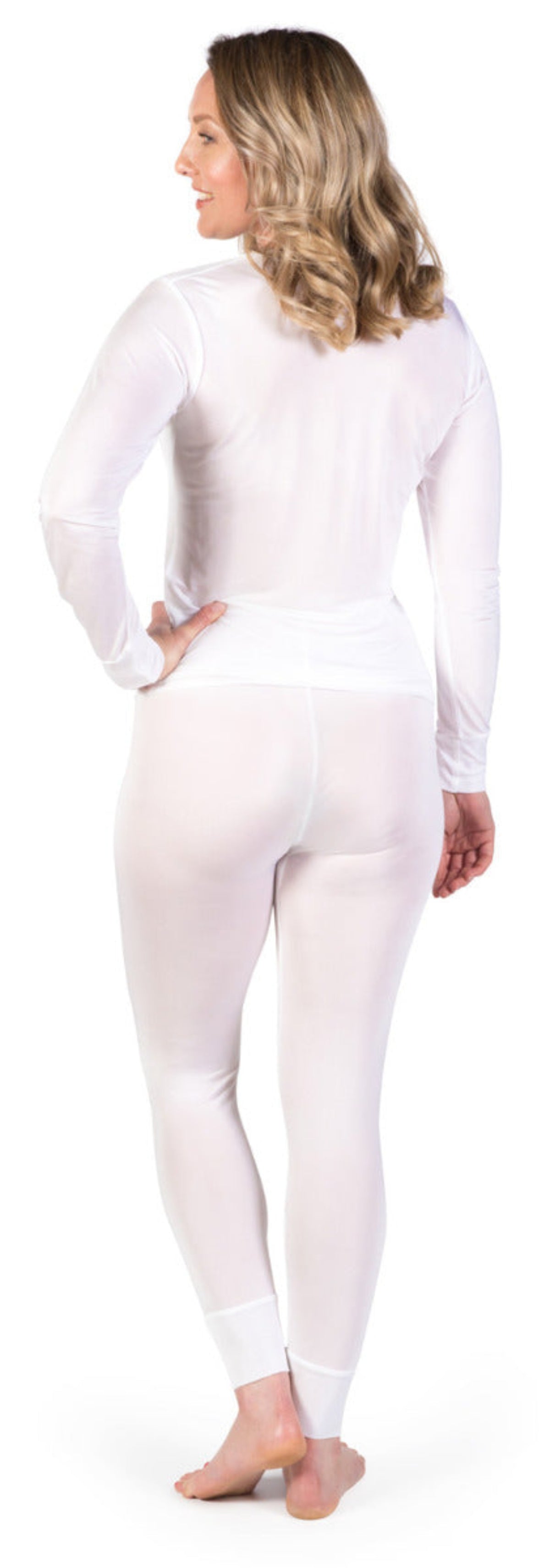 Woman wearing a white Silk underwear long sleeve top and leggings