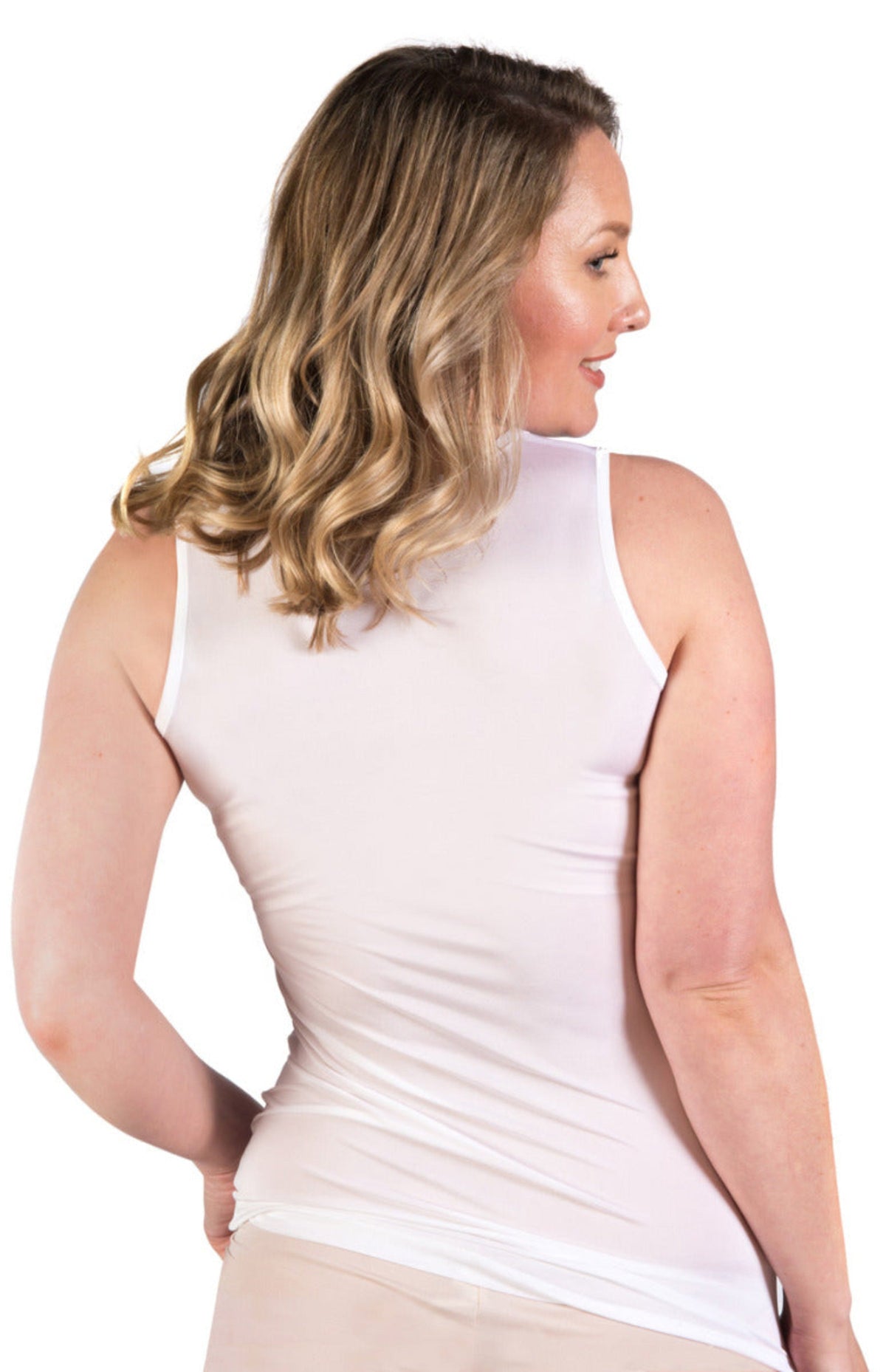 Woman wearing a white silk  classic camisole silk 